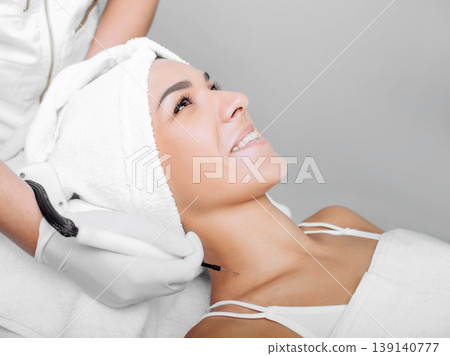 Wart removing on neck area at clinic 139140777