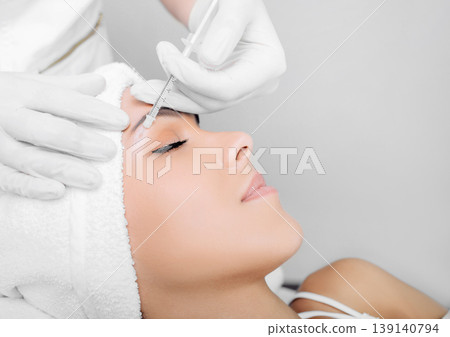 Close up of woman receiving beauty injection under eye, mesotherapy 139140794