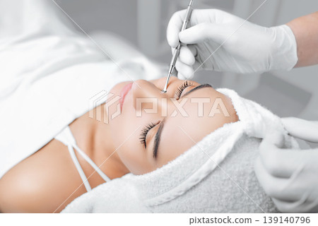 Beautiful woman having mechanical facial cleansing, remove blackhead Beautiful woman having mechanical facial cleansing, remove blackhead 139140796