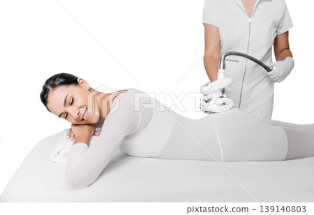 Beautiful woman receiving lpg massage against cellulite isolated on white 139140803