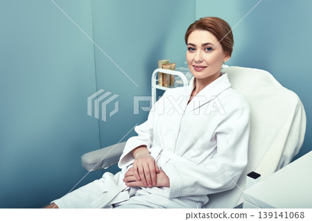 Body care. Adult beautiful woman before cosmetology procedures for her body at a beauty salon 139141068