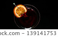 Refreshing red cocktail with orange slice garnish on dark background 139141753
