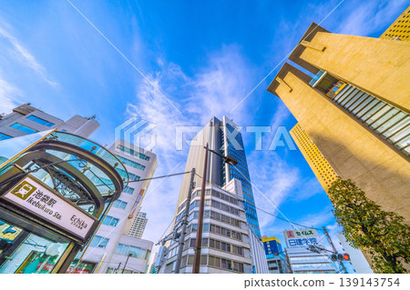 The urban landscape of Tokyo, Japan, including Ikebukuro Station and the newly completed skyscraper "IT Tower TOKYO". 139143754