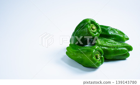 Fresh vegetable cutouts featuring bell peppers arranged against a white background. 139143780