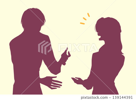 A man and a woman talking; both in casual clothes; office workers; silhouette. A man and a woman talking; both in casual clothes; office workers; silhouette. 139144391