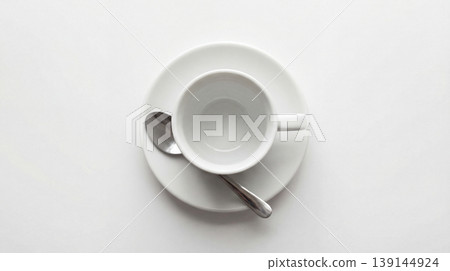 Empty white coffee cup and saucer with a spoon overhead studio shot white background still life food service hot drink tea cup espresso cup single object isolated object tableware dishware Empty white coffee cup and saucer with a spoon overhead studio shot white background still life food service hot drink tea cup espresso cup single object isolated object tableware dishware 139144924