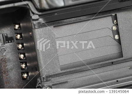 The back view of film camera see shutter pane and film slot. The back view of film camera see shutter pane and film slot. 139145064