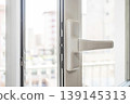 Open Window Handle with Natural Light in Modern Apartment 139145313