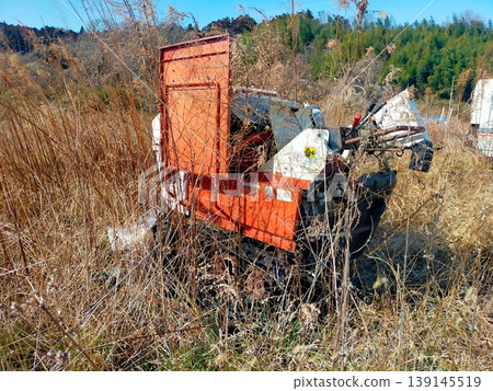 Fallen agricultural machinery Fallen agricultural machinery 139145519