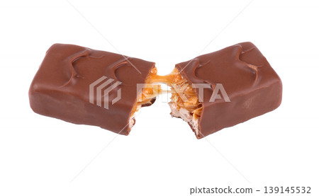Broken chocolate bar with stretching caramel, peanuts and nougat isolated on white. Protein peanut chocolate snack bar. Clipping path. 139145532