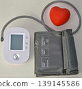 blood pressure monitor on white 139145586