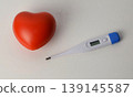 Thermometer with red heart 139145587