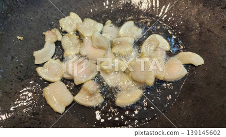 Close-up of Sizzling Pork Fat Pieces Rendering Lard in a Hot Cooking Pan Close-up of Sizzling Pork Fat Pieces Rendering Lard in a Hot Cooking Pan 139145602