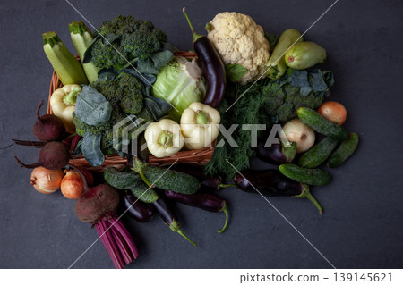 Beets and onions, ingredients for borscht. Fresh vegetables on the table black background. Set of food. Broccoli, cabbage, eggplant, white cabbage, cucumber, dill, cauliflower. Stilllife top view. Beets and onions, ingredients for borscht. Fresh vegetables on the table black background. Set of food. Broccoli, cabbage, eggplant, white cabbage, cucumber, dill, cauliflower. Stilllife top view. 139145621