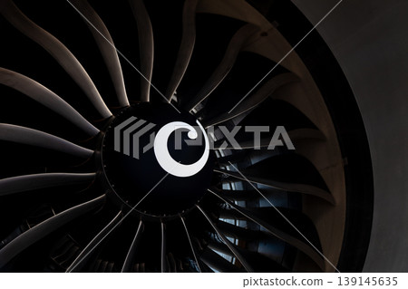 Plane background. Airplane turbine blades close-up. Airplane engine. Turbines blade. Aviation Technologies. Aircraft jet black detail during maintenance. Plane background. Airplane turbine blades close-up. Airplane engine. Turbines blade. Aviation Technologies. Aircraft jet black detail during maintenance. 139145635