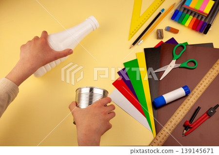 Step 2. Step-by-step instructions on how to make a stand for stationery from recycled materials. Do it yourself. A glass for pencils and pens from a plastic bottle and a can. A fun craft for kids DIY 139145671