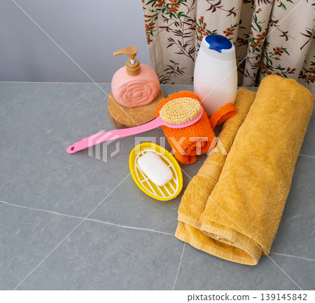 Assortment of Soaps and Dispensers bottles. Natural eco set of shower gels and lotions and a washcloth, towel. Table top view in bathroom Assortment of Soaps and Dispensers bottles. Natural eco set of shower gels and lotions and a washcloth, towel. Table top view in bathroom 139145842