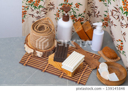 Assortment of Soaps and Dispensers bottles. Natural eco set of shower gels and lotions and a washcloth top view. Tar soaps bar Assortment of Soaps and Dispensers bottles. Natural eco set of shower gels and lotions and a washcloth top view. Tar soaps bar 139145846