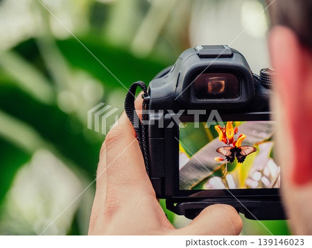 man taking photo of nature photographer man taking photo of nature photographer 139146023