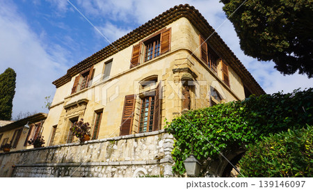 Traditional old stone houses on a street in the medieval town of Saint Paul de Vence, French Riviera, South of France Traditional old stone houses on a street in the medieval town of Saint Paul de Vence, French Riviera, South of France 139146097