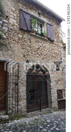 Traditional old stone houses on a street in the medieval town of Saint Paul de Vence, French Riviera, South of France Traditional old stone houses on a street in the medieval town of Saint Paul de Vence, French Riviera, South of France 139146104