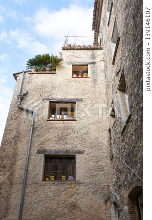 Traditional old stone houses on a street in the medieval town of Saint Paul de Vence, French Riviera, South of France Traditional old stone houses on a street in the medieval town of Saint Paul de Vence, French Riviera, South of France 139146107