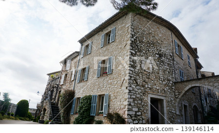 Traditional old stone houses on a street in the medieval town of Saint Paul de Vence, French Riviera, South of France Traditional old stone houses on a street in the medieval town of Saint Paul de Vence, French Riviera, South of France 139146114