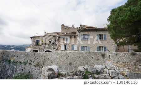 Traditional old stone houses on a street in the medieval town of Saint Paul de Vence, French Riviera, South of France Traditional old stone houses on a street in the medieval town of Saint Paul de Vence, French Riviera, South of France 139146116