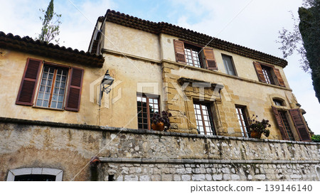 Traditional old stone houses on a street in the medieval town of Saint Paul de Vence, French Riviera, South of France Traditional old stone houses on a street in the medieval town of Saint Paul de Vence, French Riviera, South of France 139146140