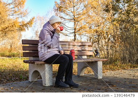 old age, retirement and people concept - close up of happy senior woman at autumn park drinking takeaway coffee 139146479