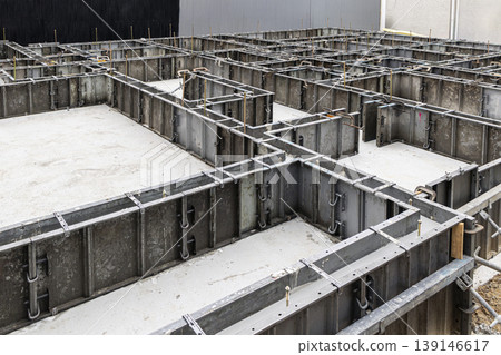 Construction site, building foundation work: Installation of steel formwork. Suitable for commercial use and advertising. Construction site, building foundation work: Installation of steel formwork. Suitable for commercial use and advertising. 139146617