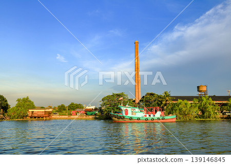 Tugboat, fire boat standby for service near Bang jak petrochemical plant, Bangkok Thailand. Tugboat, fire boat standby for service near Bang jak petrochemical plant, Bangkok Thailand. 139146845