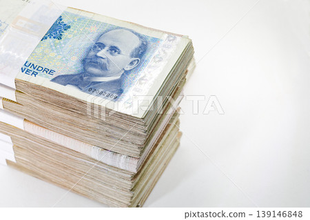 Many packs of Norway krone bills, 200 krone, stacks of banknotes, pile of cash, paper money. The concept of financial success, Investment and wealth. isolate on white background. Many packs of Norway krone bills, 200 krone, stacks of banknotes, pile of cash, paper money. The concept of financial success, Investment and wealth. isolate on white background. 139146848