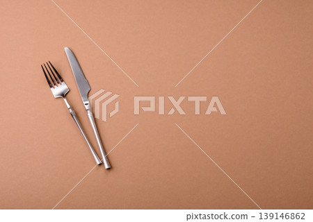 A knife and fork, silver kitchen utensils for the dining table. A knife and fork A knife and fork, silver kitchen utensils for the dining table. A knife and fork 139146862