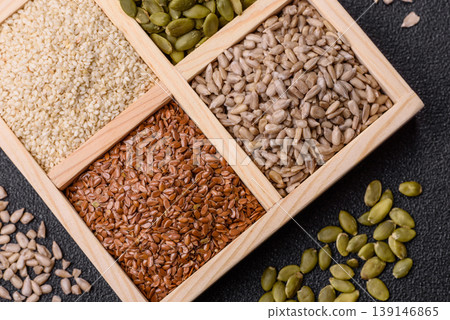 Flax, pumpkin, sunflower, and sesame seeds, ingredients for healthy eating 139146865