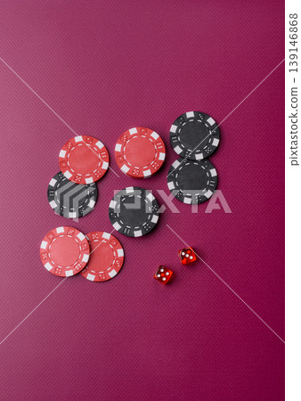 Casino dice and chips on a colored background, poker, gambling with bets. Dice and chips 139146868