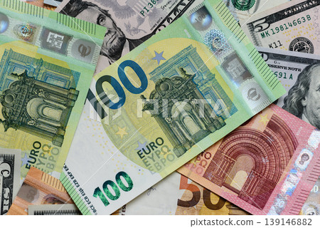 Euro and dollar banknotes, exchange, sales, economic tariffs and taxes. Euros and dollars Euro and dollar banknotes, exchange, sales, economic tariffs and taxes. Euros and dollars 139146882