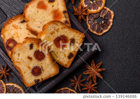 Fruit cake, a dessert with cherries, plums, and raisins for a festive Christmas table. Fruit cake Fruit cake, a dessert with cherries, plums, and raisins for a festive Christmas table. Fruit cake 139146886