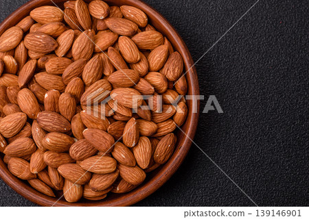 Raw and peeled almonds as a healthy food ingredient. Almonds as a food background Raw and peeled almonds as a healthy food ingredient. Almonds as a food background 139146901