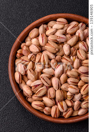 Salted pistachio nuts in shells as a healthy, high calorie food ingredient. Pistachio nuts Salted pistachio nuts in shells as a healthy, high calorie food ingredient. Pistachio nuts 139146905