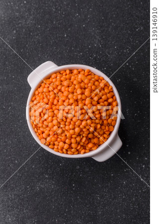 Raw red lentils as a source of protein for a healthy vegan meal. Red lentils Raw red lentils as a source of protein for a healthy vegan meal. Red lentils 139146910