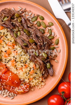 A bowl with beef, porridge, mushrooms, vegetables, sauce, and spices. Beef bowl A bowl with beef, porridge, mushrooms, vegetables, sauce, and spices. Beef bowl 139146937