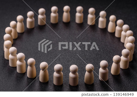Wooden figurines as a concept for human resources, recruiting team members. Wooden figurines 139146949