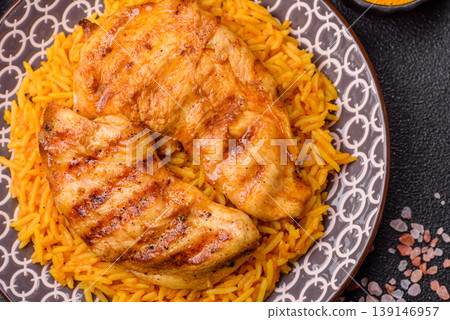 Kabsa or haneeth, an Arabic dish with rice and chicken, salt, and spices. Kabsa or haneeth Kabsa or haneeth, an Arabic dish with rice and chicken, salt, and spices. Kabsa or haneeth 139146957