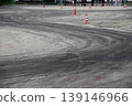 Drift track with tires traces between safety cones  139146966