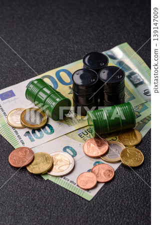 A barrel of oil against a backdrop of euro as a concept for the oil crisis. A barrel of oil A barrel of oil against a backdrop of euro as a concept for the oil crisis. A barrel of oil 139147009