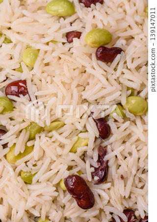 Asian food with rice, edamame, carrots, tofu, and spices. Rice with edamame 139147011
