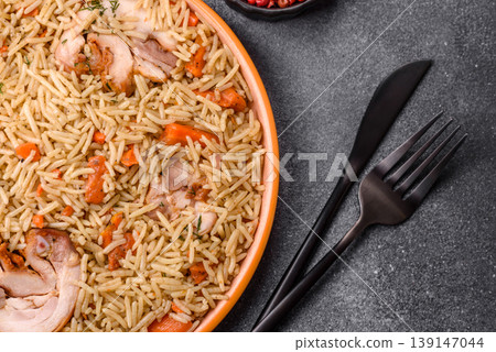 Kabsa or mandi, an Arabic dish with rice and chicken, salt, and spices. Kabsa or mandi Kabsa or mandi, an Arabic dish with rice and chicken, salt, and spices. Kabsa or mandi 139147044