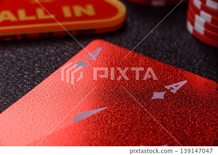 Playing cards and chips on a table, a gambling game of blackjack or baccarat. Cards and chips Playing cards and chips on a table, a gambling game of blackjack or baccarat. Cards and chips 139147047