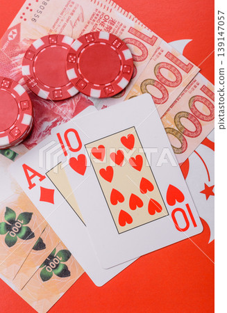 Playing cards and chips on a table, a gambling game of blackjack or baccarat. Cards and chips 139147057